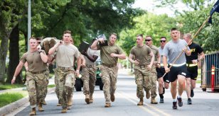 Soldiers from the 3d U.S. Infantry Regiment (The Old Guard) participate in a litter-carrying competition during the 4th annual Urban Warrior Challenge 22 June, 2017 on Joint Base Myer-Henderson Hall, Va. The competition brings the Army and Marines together in games and challenges that help build team cohesion, camaraderie and offers something to do for the whole family. (U.S. Army Photo by Sgt. Nicholas T. Holmes)